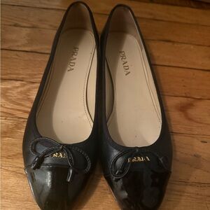 Prada Black Leather Ballet Flats with Patent Cap-Toe and Bow
